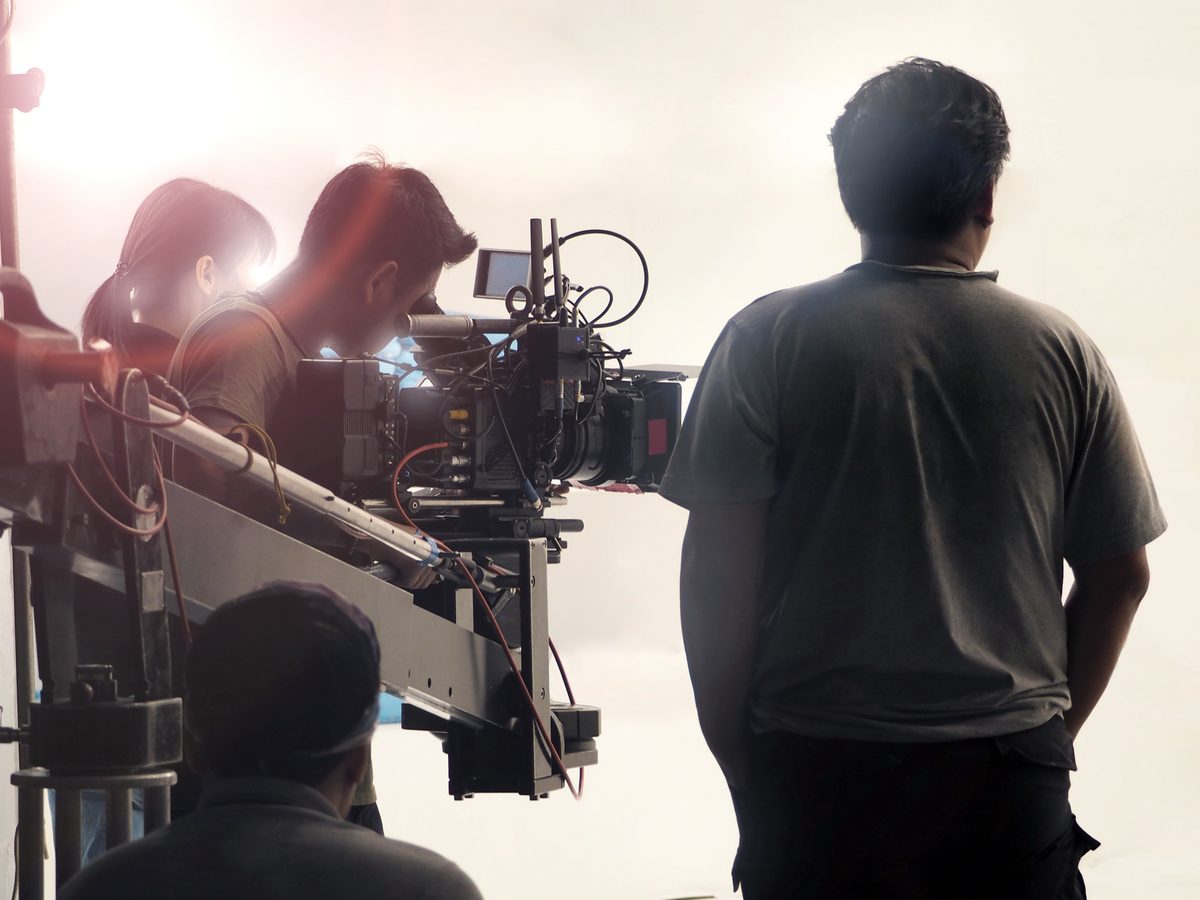 Camera crew setting up at the cyclorama studio before action is called